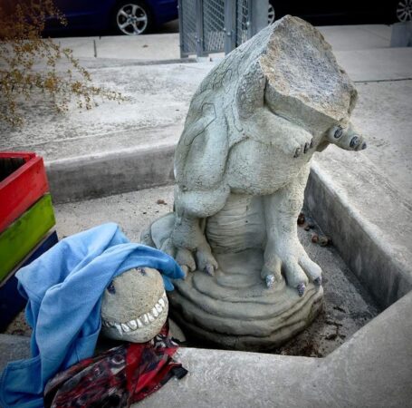 Beloved stone dinosaur, Bridget the Dino, has its head smashed off in Manayunk. The community wants answers for its garden guardian.