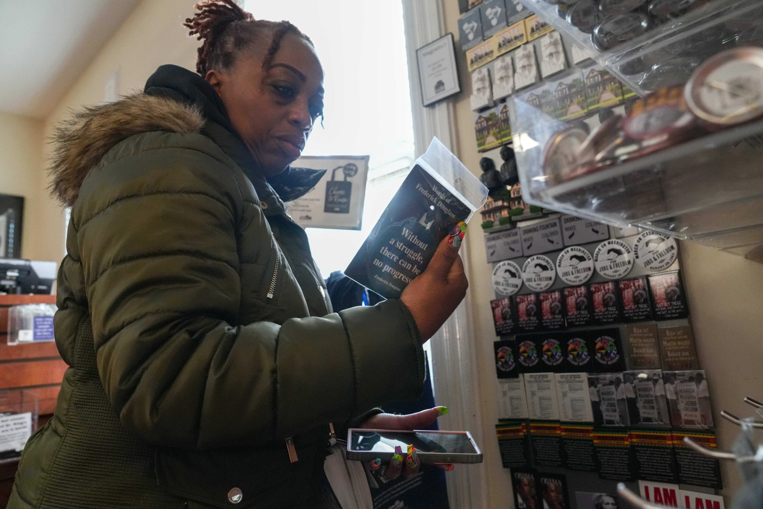 Keisha Burse looks at items for sale at Martin Luther King Jr. National Historical Park in Atlanta earlier this week.