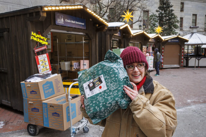 This hut at the Christmas Village sells 300 to 500 packages a day. Nobody knows what’s inside of them.