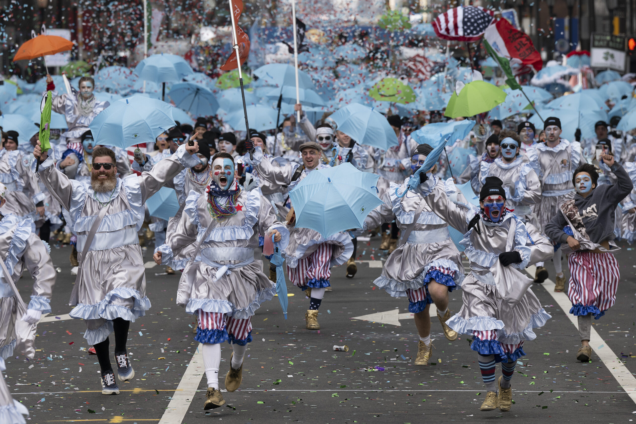 Members of the Froggy Carr Brigade strut down Market street on Monday, Jan 1, 2024, during the start of the 2024 Philadelphia's Mummers parade in Philadelphia.