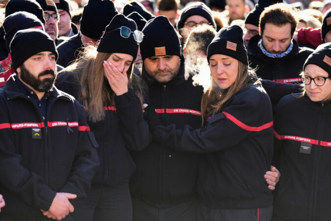 Hundreds march in silence to honor victims of Swiss bar fire that left 40 dead