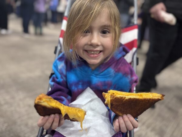 Penelope Nark, the author's daughter, enjoyed a grilled cheese offered by the PA Dairymen's Association.