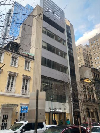 A Walnut Street building where John Lennon and Roger Ailes once worked just sold for a steep discount