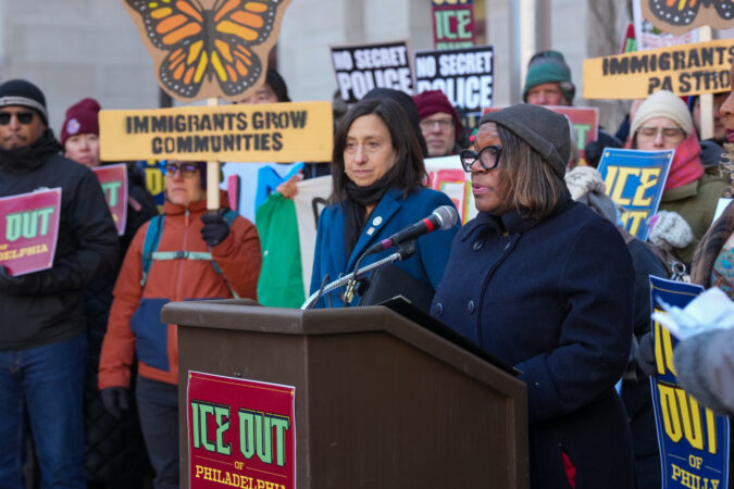City Councilmember Kendra Brooks speaks at a news conference unveiling the "ICE Out" legislative package as Councilmember Rue Landau, center, looks on.