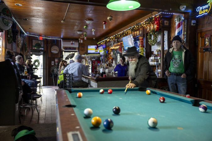 Al Luecke, 77, of Fishtown, a regular at J.R’s Saloon for 25 years, playing pool on Thursday, Dec. 18, 2025.