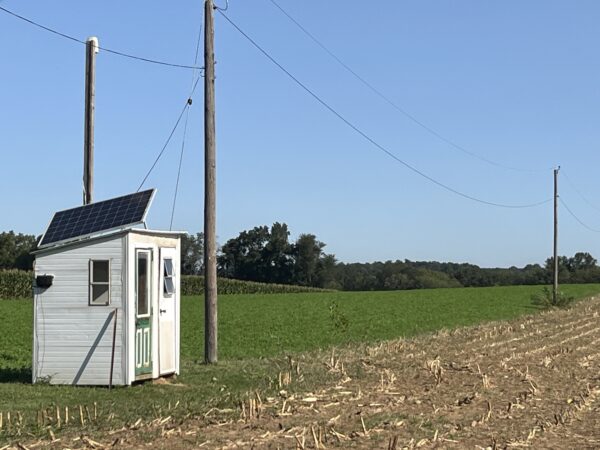 A solar-powered phone shack and wires on a farm near Ephrata, Pa. in September 2025. Plain rules vary. Some Amish and traditional Mennonite congregations use word-processing computers so members can better manage their farms and other businesses.