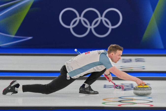 Norway's Magnus Nedregotten delivers a stone against Britain during the mixed doubles round robin phase of the curling competition at the 2026 Winter Olympics on Wednesday.
