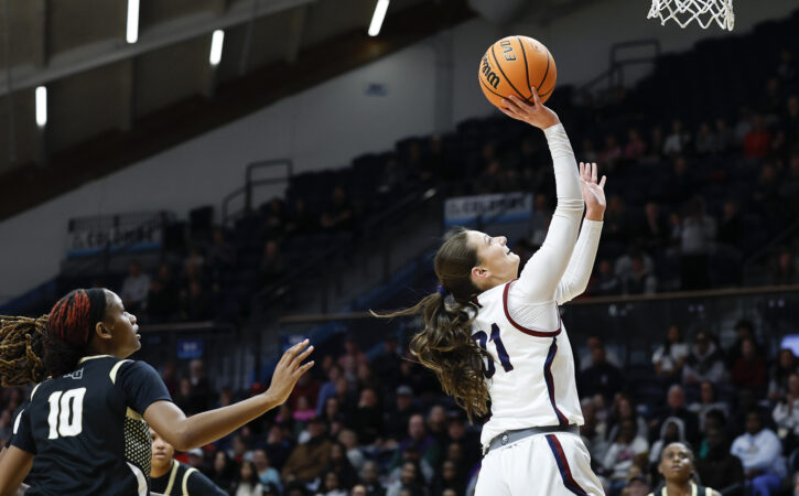 Cardinal O’Hara's Megan Rullo (right) drives to the basket against Neumann Goretti on Monday.