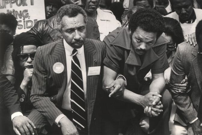 Rep. Parren Mitchell (left), a Maryland Democrat, and Jesse Jackson pray on the sidewalk in front of the White House as they lead a march to the Capitol in 1985.