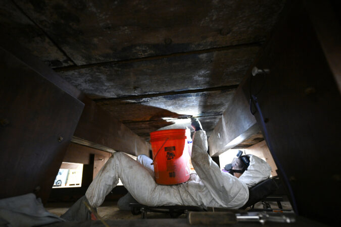 Angela Paola, a conservator at Texas A&M University, works on a preservation project of the gunboat Philadelphia at the Smithsonian National Museum of American History this month. The ship was sunk on Oct. 11, 1776 during the Battle of Valcour Island. It was retrieved from Lake Champlain in 1935.