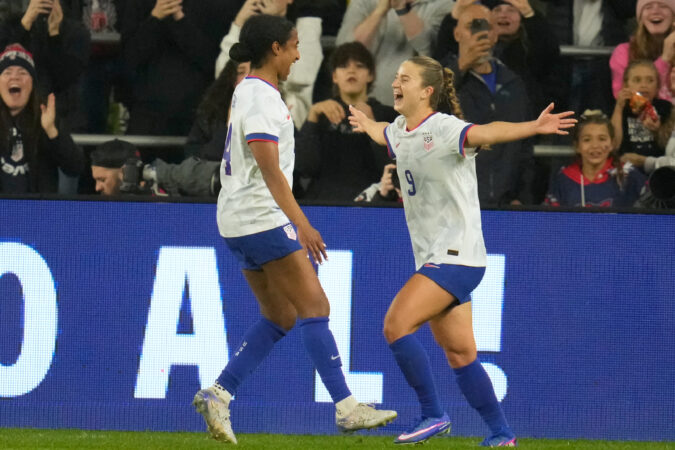 Ally Sentnor (right) celebrates after scoring her goal.