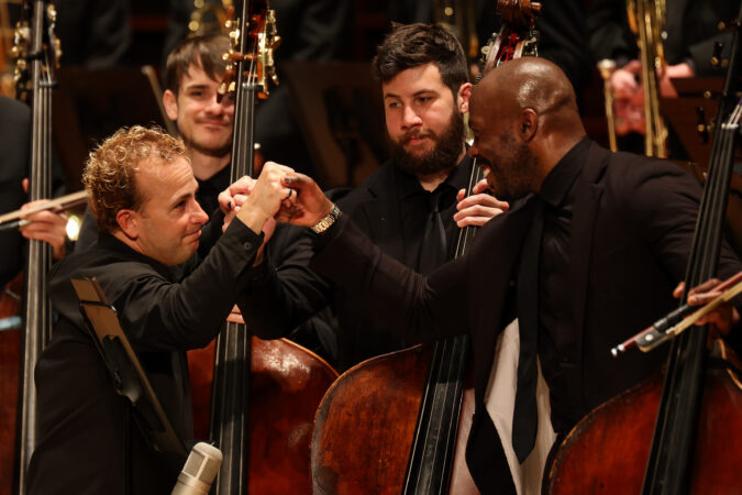 Conductor Yannet Nézet-Séguin fist bumps Principal Double Bass Joseph Conyers after the Philadelphia Orchestra’s performance of Mahler’s Symphony No. 2 at The Kimmel Center on Friday, March 6, 2026, in Philadelphia.