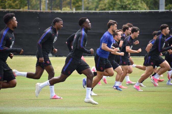 Folarin Balogun (center) running with teammates during a United States men's national soccer team practice at Great Park in Irvine, California on Sunday.