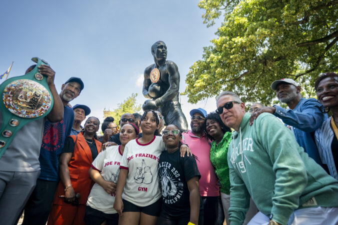 Mayor Cherelle L. Parker, Frazier family members, boxers and other dignitaries unveil the new home for its statue of heavyweight boxing champion Joe Frazier on Monday, June 29, 2026, in Philadelphia, Pennsylvania. The statue is installed at the base of the steps of the Philadelphia Museum of Art where a statue of fictional boxer Rocky Balboa once stood.