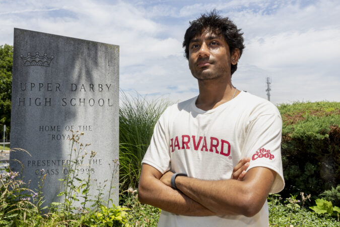 Khandakar Mahin stands for a portrait at Upper Darby High School this month. He is headed to Harvard this fall and hopes to pursue a career in AI ethics and policy.