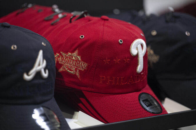 Commemorative baseball caps on display at All-Star Village inside the Convention Center.