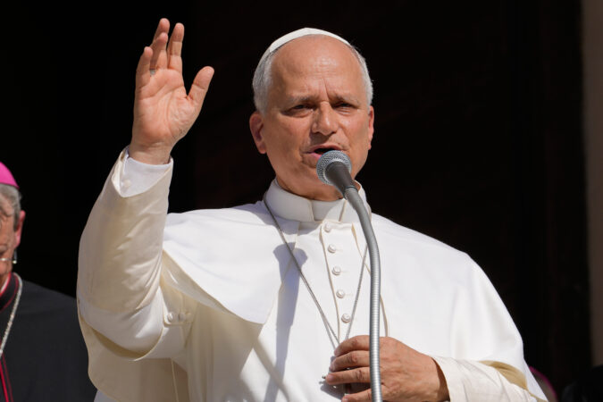 Pope Leo XIV delivers his blessing as he visits Pavia's Cathedral, northern Italy, on June 20, 2026. (AP Photo/Luca Bruno, File)