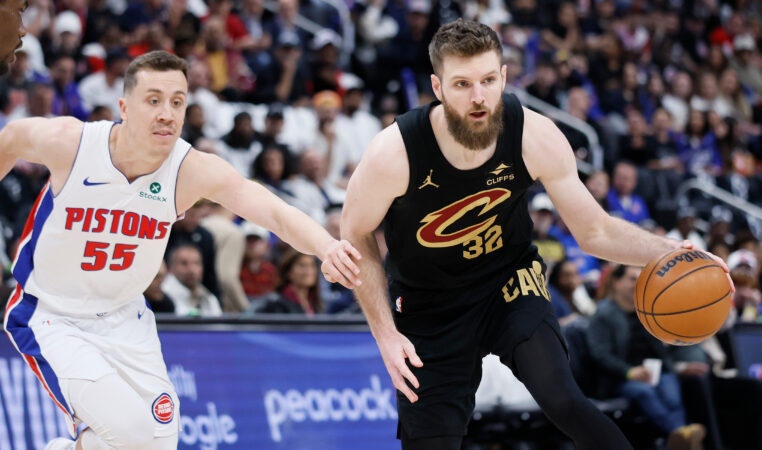 Cleveland Cavaliers forward Dean Wade (32) is guarded by Detroit Pistons forward Duncan Robinson (55) during the first half in Game 1 of a second-round NBA playoffs basketball series Tuesday, May 5, 2026, in Detroit. (AP Photo/Duane Burleson)