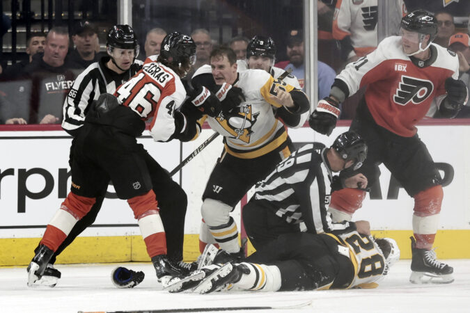 Flyers center Trevor Zegras and Penguins center Noel Acciari tangle during a game in October.
