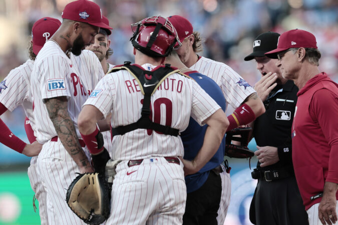 A Phillies trainer works on pitcher Cristopher Sánchez’s hand in the second inning after he had a scrape on his finger. He went on to throw seven scoreless innings.