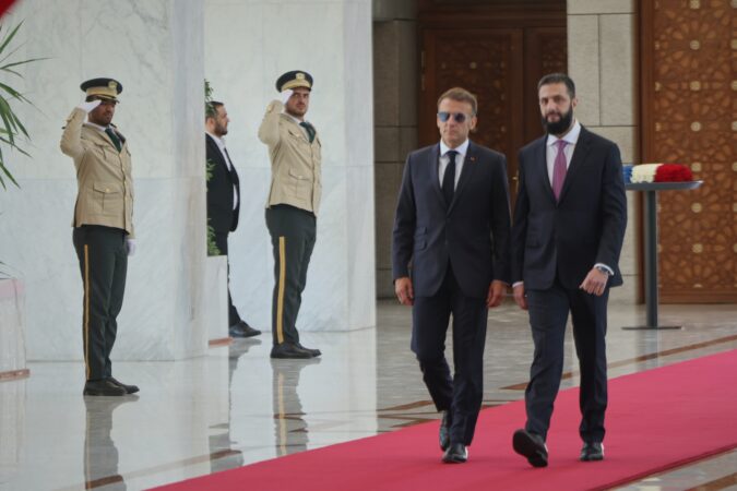 Explosions rock Damascus, wounding 18, as French President Macron visits Syria